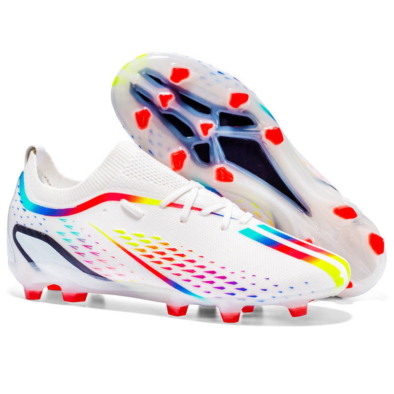 White soccer cleats with colorful accents on a white background