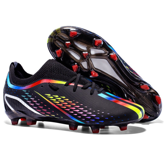 Black soccer cleats with colorful accents on a white background